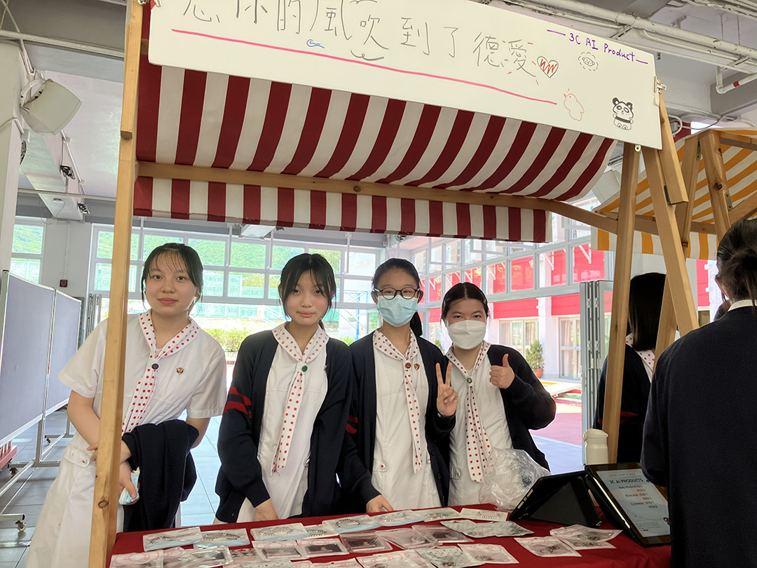 A person standing in front of a bannerDescription automatically generated